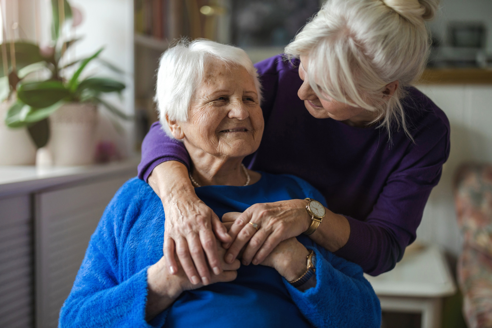Elderly woman talking to her daughter